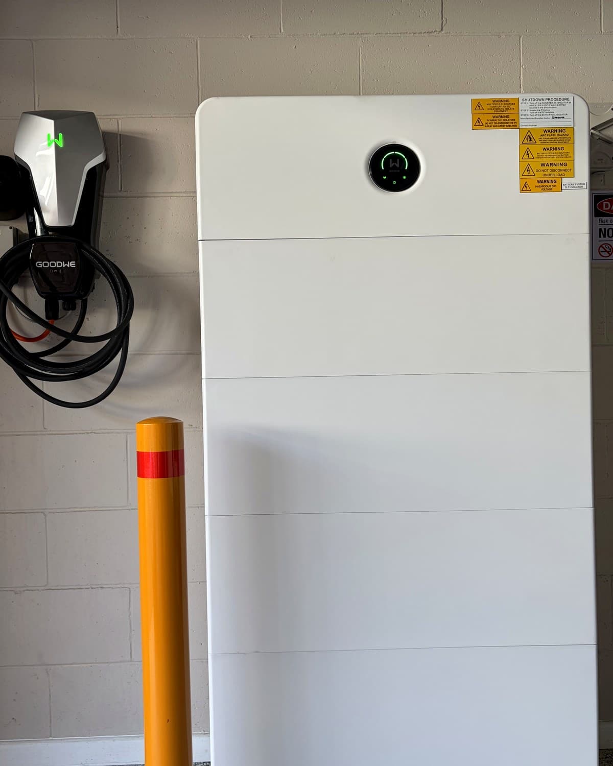 GoodWe battery and EV charger mounted in a garage